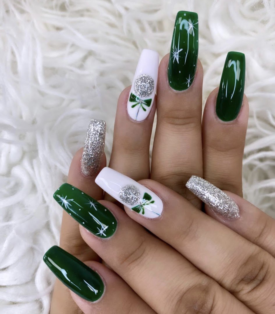 Nail art tools beside finished manicures